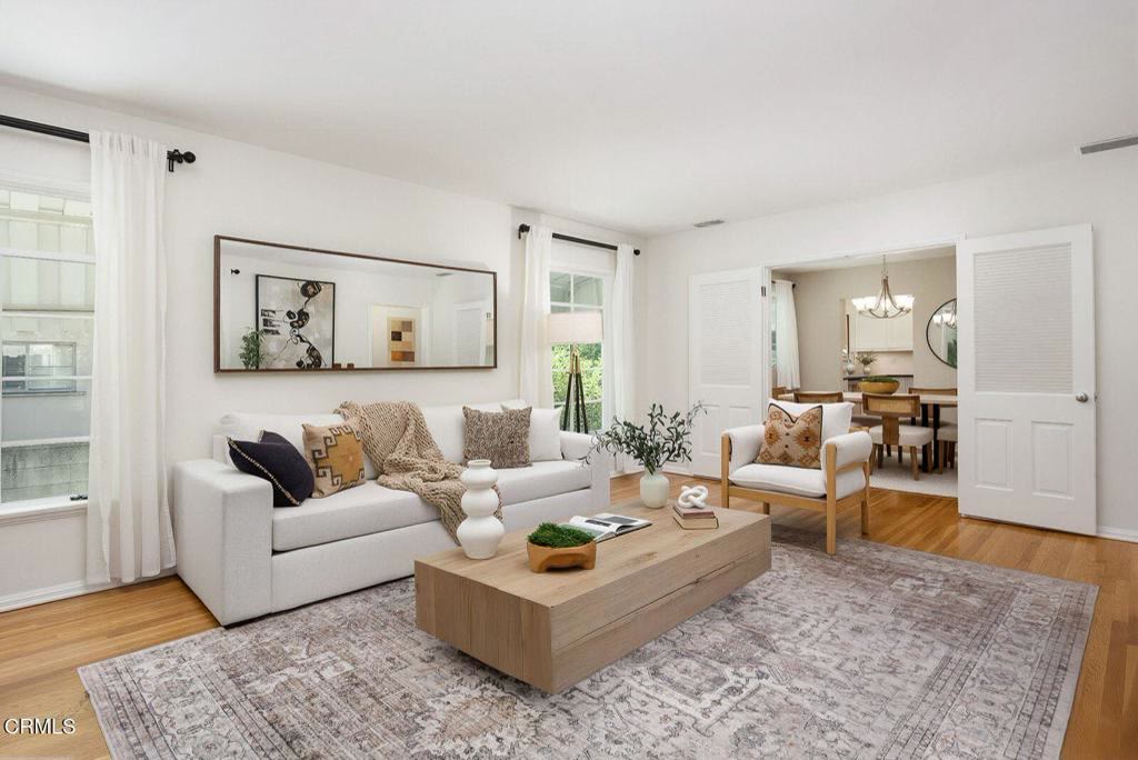 Open living room with hardwood floors and garden views