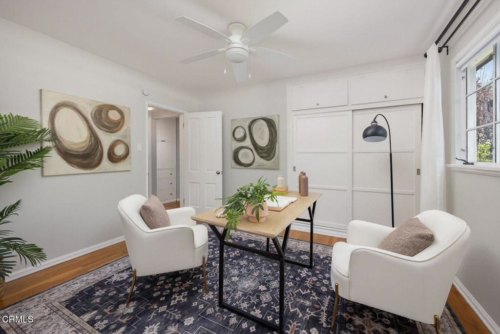 Bedroom with ceiling fan and closet
