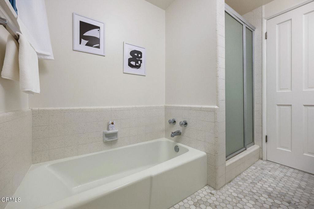 Second bath with soaking tub and glass enclosure