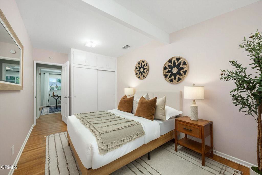Bedroom with mirrored closet doors